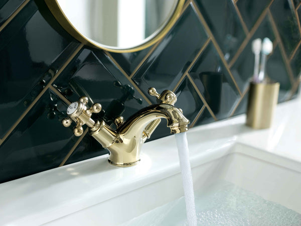 JTP Grosvenor Cross basin mixer tap with pop-up waste, chrome finish, mounted on bathroom sink, modern design.