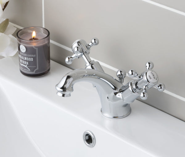 JTP Grosvenor Cross basin mixer tap with pop-up waste, chrome finish, modern design, mounted on a bathroom sink.