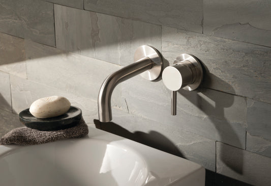 JTP Inox wall-mounted basin mixer tap with single lever, modern design, installed on bathroom sink for easy water control