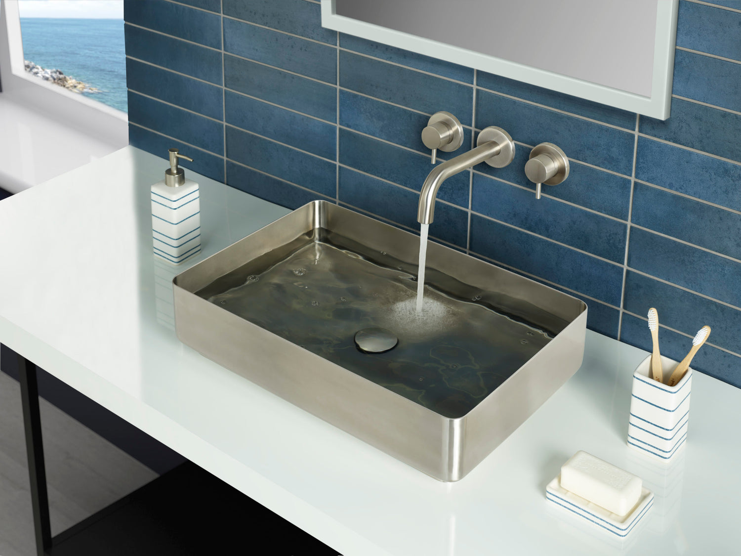 JTP stainless steel wall-mounted bath and basin filler set with three-hole design, sleek rectangular spout for modern bathrooms.