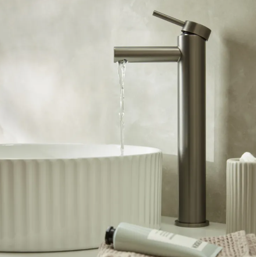 Tavistock Anthem tall basin mixer tap with click waste, featuring modern chrome finish and sleek design.