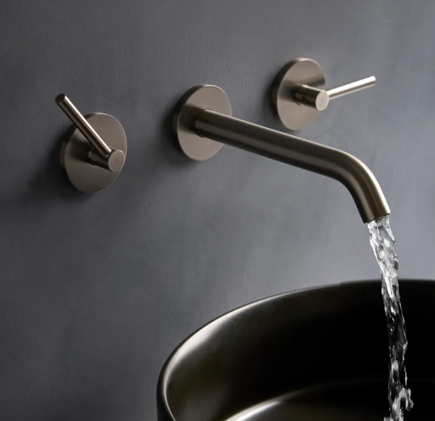 Tavistock Cohort lever wall-mounted basin mixer tap with modern design, chrome finish, and single lever control for bathroom sink.