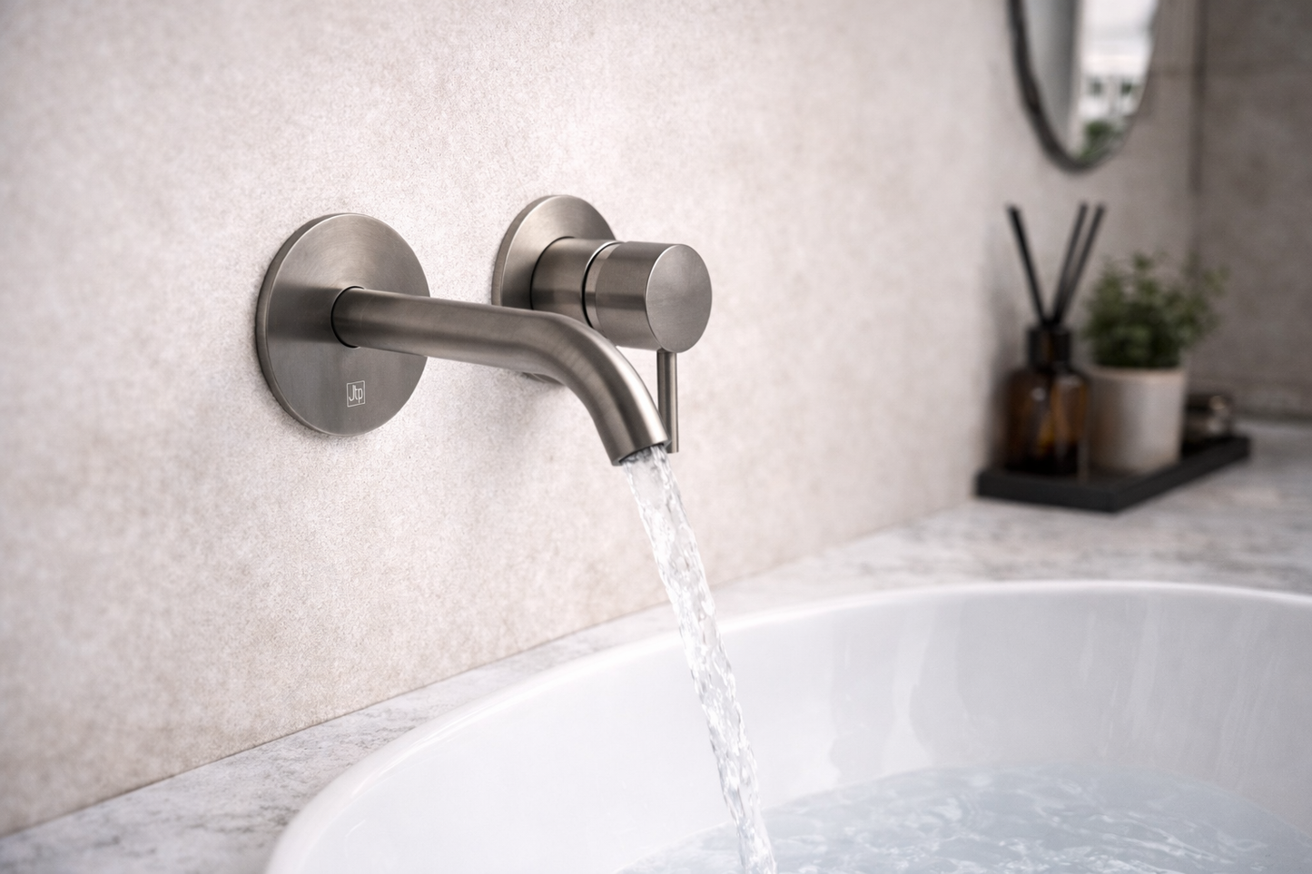 Modern bathroom faucet with water flowing into a bathtub.